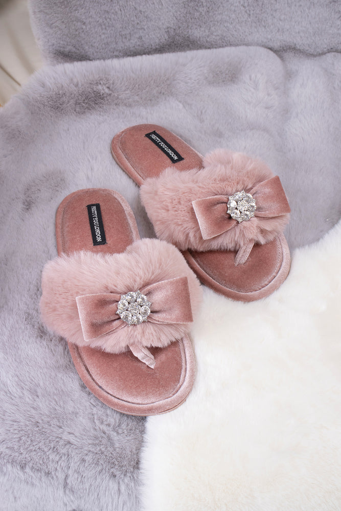 Amelie women's toe post slippers in pink with a premium velvet bow and diamante embellishment atop a plush faux fur band from Pretty You London