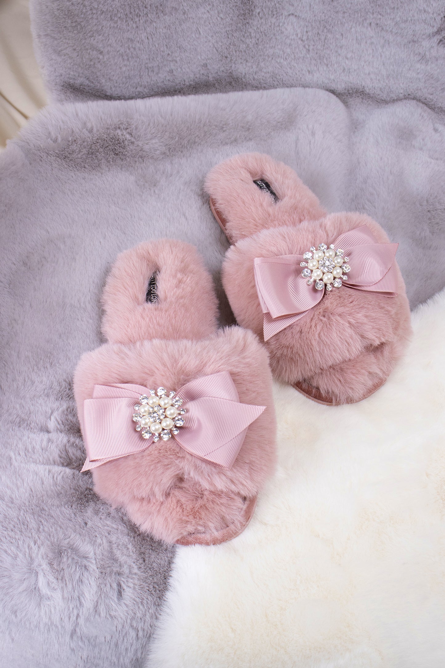 Anya women's slider slippers in pink using the softest faux furs and topped with a premium grosgrain bow finished with a jewel pearl embellishment from Pretty You London