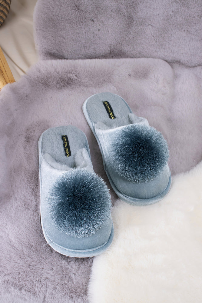 
                  
                    Coco women's mule slippers in duck egg blue with faux fur lining, velvet upper and finished with a satin fringe pom from Pretty You London
                  
                