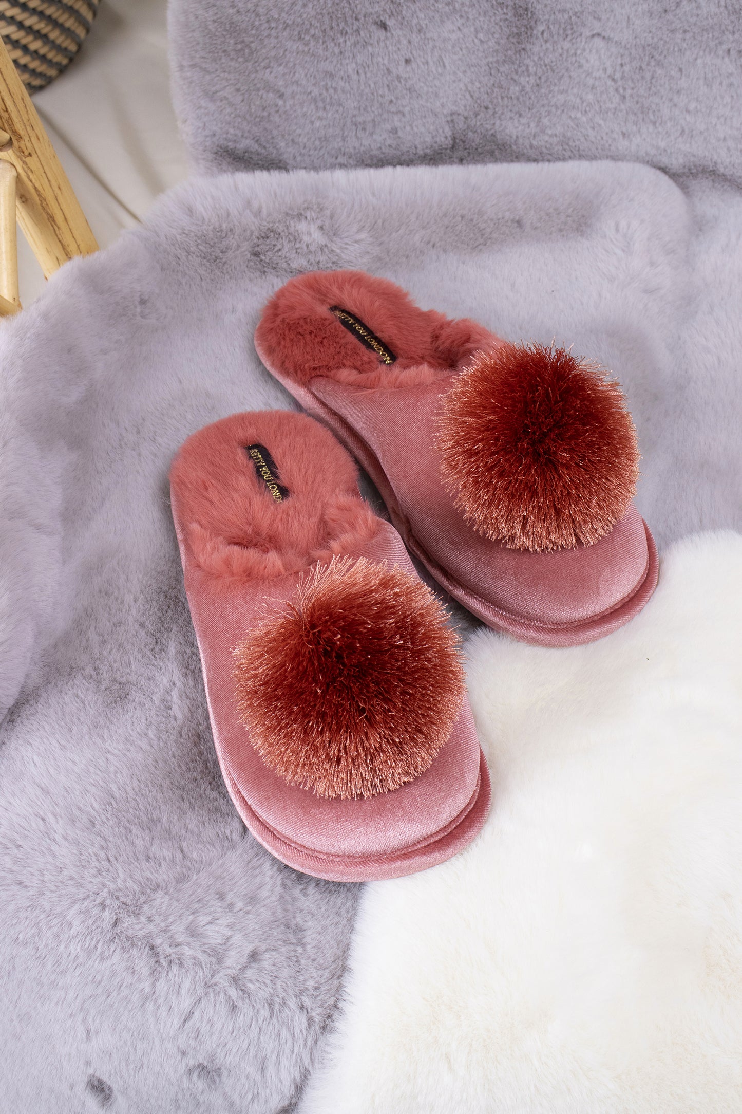 
                  
                    Coco women's mule slippers in terracotta with faux fur lining, velvet upper and finished with a satin fringe pom from Pretty You London
                  
                
