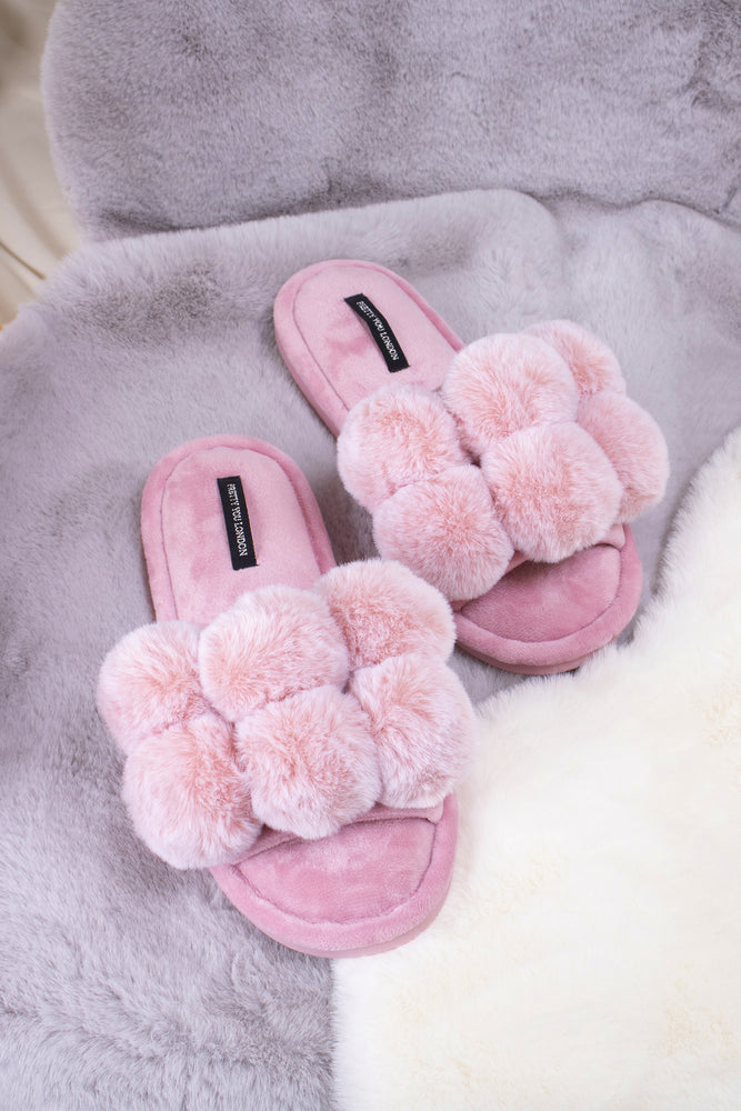 Dolly women's slider slippers in pink with oversized faux fur pom poms from Pretty You London