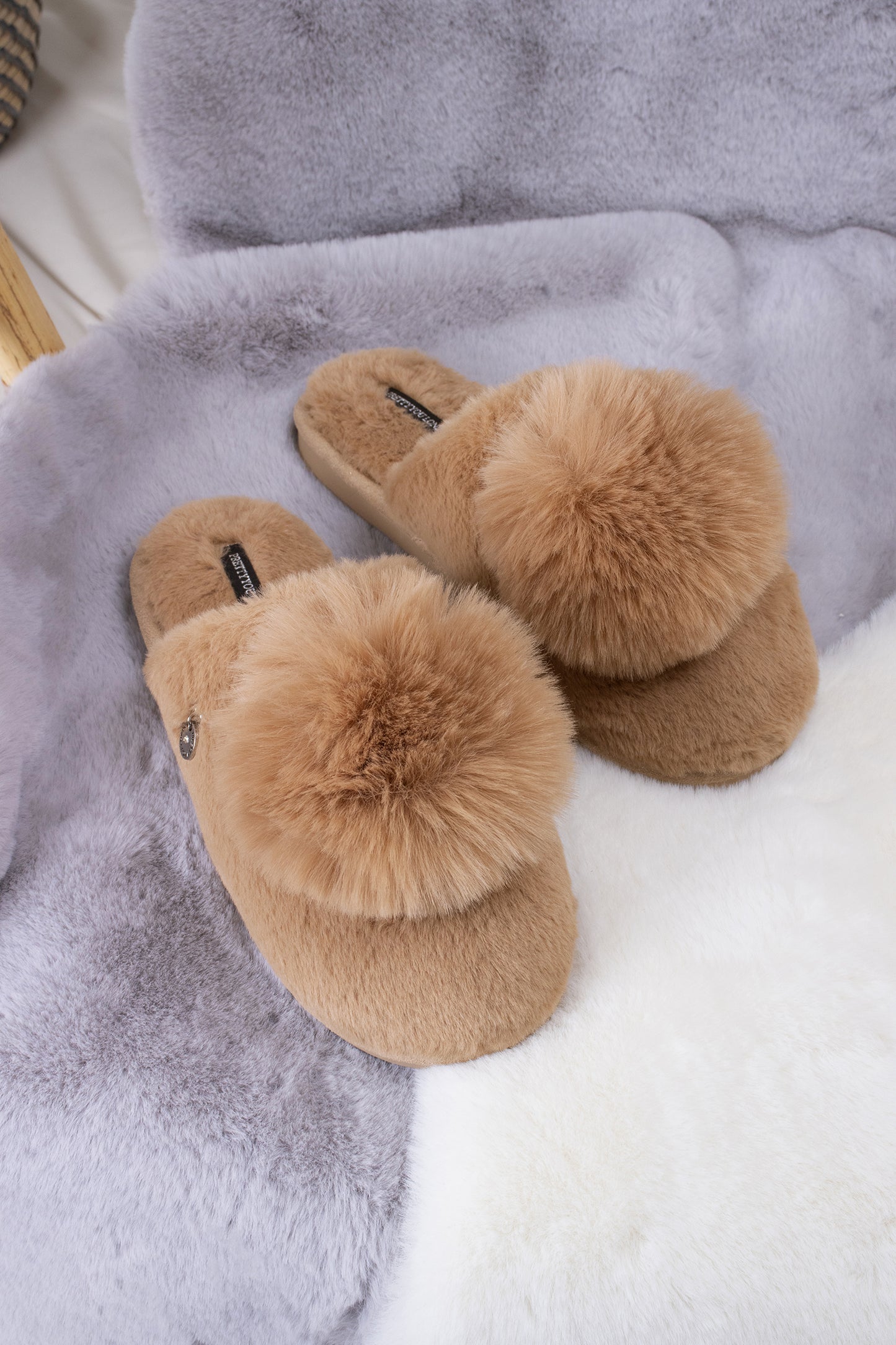 Etta women's mule slippers in camel with a statement oversized pom and metallic faux-suede binding from Pretty You London