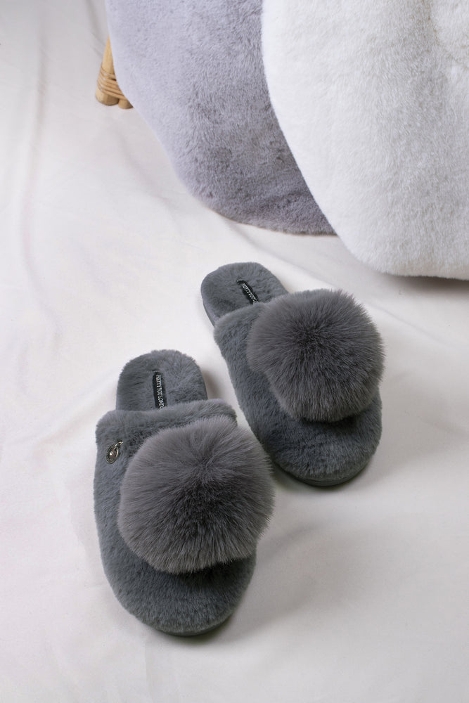 Etta women's mule slippers in grey with a statement oversized pom and metallic faux-suede binding from Pretty You London