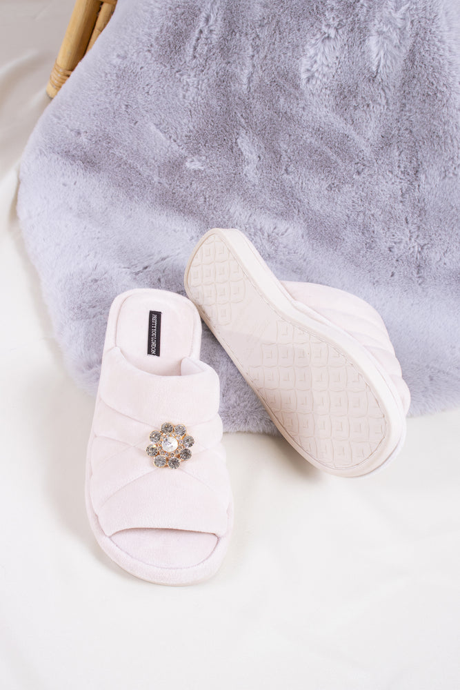 
                  
                    Faye women's slider slippers in powder puff pink combining brushed microfibre materials and a glimmering crystal brooch from Pretty You London
                  
                