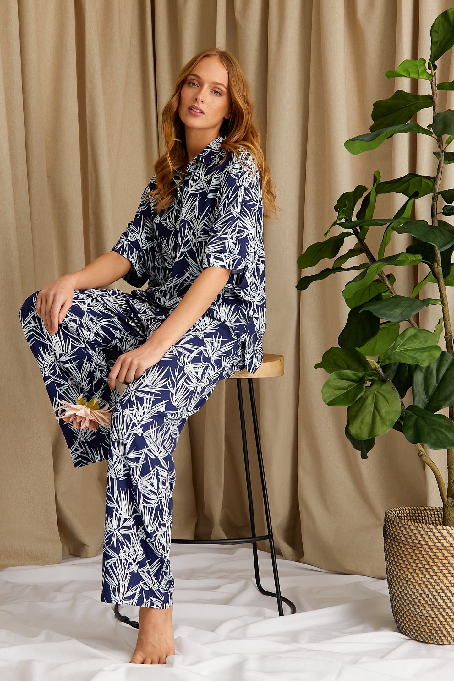 
                  
                    Women's Printed Studio Long Pyjama Set in Midnight Blue with tonal palm print from Pretty You London
                  
                
